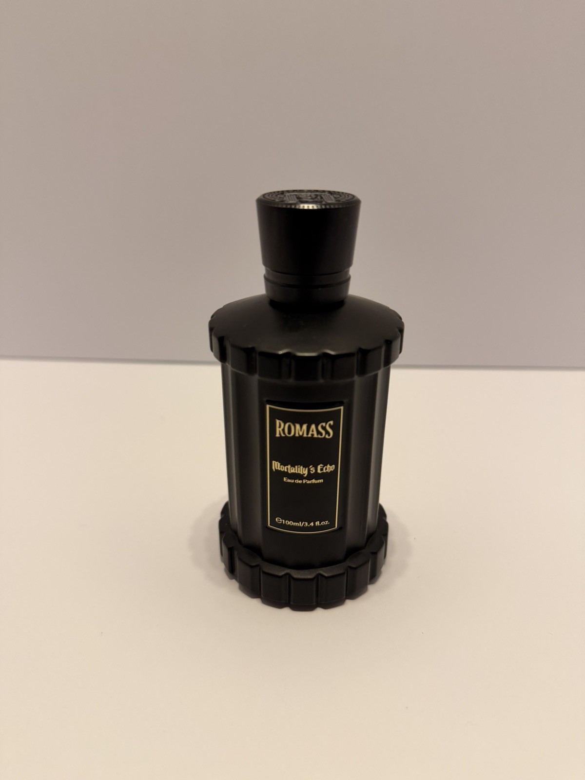 cologne for men Romass Mortality’s Echo Eau de Perfume Black bottle Gold text.